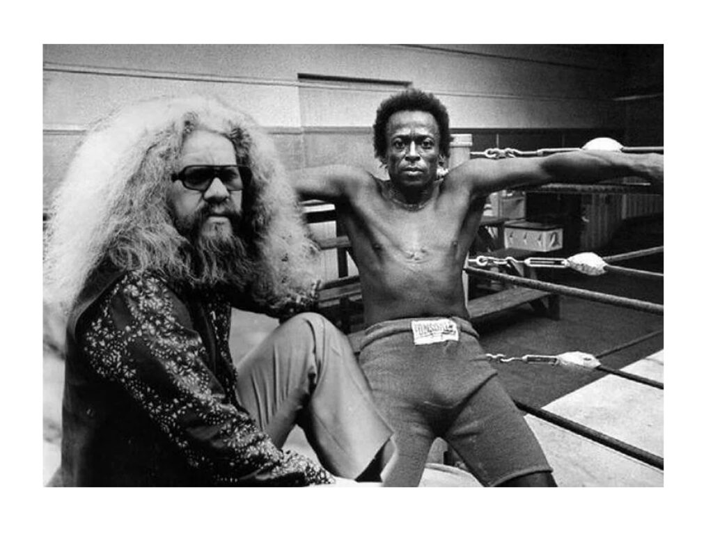 Hermeto Pascoal em luta de boxe com Miles Davis